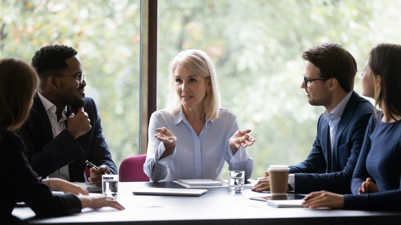 Female lawyer talking to her legal team in the office